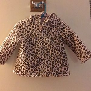 Leopard spots on pink coat with hood